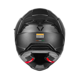 Motodrift Korda Evo Solid full face motorcycle helmet in matte black, rear view showing ventilation and safety labels.