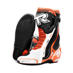 TR TIGER X TWO motorcycle racing boots in white, black, and orange with titanium sliders and rubber soles.