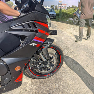 Three-quarter front view of Aprilia RS 457 with black and red bodywork