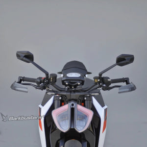 Barkbusters AERO-GP black lever protectors installed on a motorcycle handlebar for track and street use.