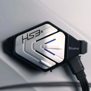 BluArmor HS3 helmet Bluetooth device with silver and black finish mounted on a white helmet surface
