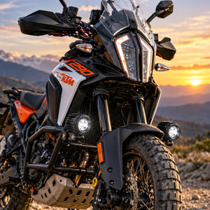 DENALI D2 v2.0 LED auxiliary lights mounted on an adventure motorcycle at sunset.