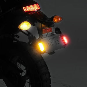 Denali T3 license plate mount with illuminated signal pods installed on a motorcycle rear fender