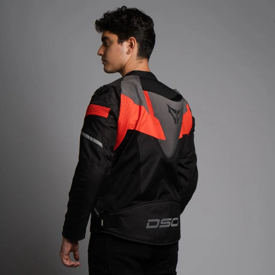 Person wearing a black and red motorcycle jacket with 'DSG' branding on a gray background, DSG Apex V2 Riding Jacket with CE Level 2 armor and AA safety certification
