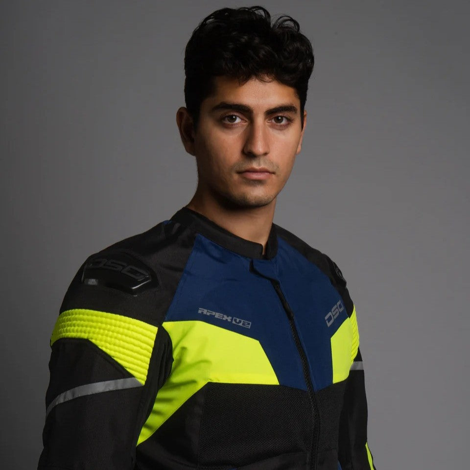 Man wearing a black, blue, and yellow motorcycle jacket against a gray background,DSG Apex V2 Riding Jacket with CE Level 2 armor and AA safety certification