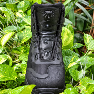 Korda Recon waterproof motorcycle riding boots in black with FITGO dial closure system in a garden setting