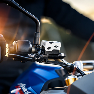 Silver CNC-machined aluminium Tricorn front oil cap installed on a TVS Apache RTX 300 motorcycle handlebar