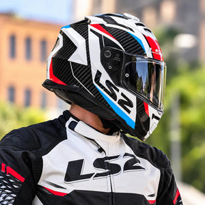 LS2 FF800 Storm II Racer helmet in blue, red, and white gloss with carbon fiber accents worn by a rider.