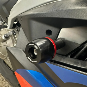 MK Racing black Delrin frame slider with red accent ring installed on an Aprilia RS 457 motorcycle
