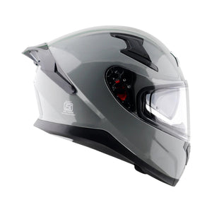 Motodrift Axor Apex Solid full-face motorcycle helmet in glossy grey with a clear visor and aerodynamic design.
