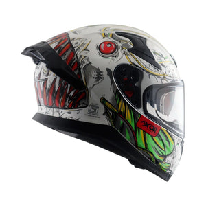Motodrift Axor Apex Seadevil full-face helmet with white base and aggressive monster graphic, side profile view.