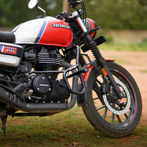 Motodrift Moto Torque V2.0 black steel crash guard installed on a red and white Honda CB350 RS motorcycle