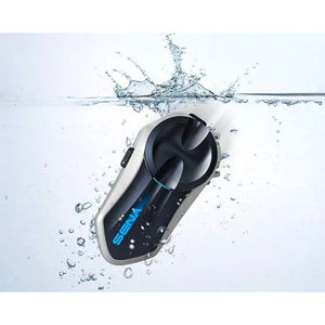 Motodrift Sena B20 Bluetooth motorcycle intercom system submerged in water, highlighting its IP67 waterproof design.