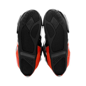 Motodrift TR Tiger X-ONE PRO motorcycle boots showing the high-density composite rubber soles with textured grip