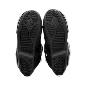 Motodrift TR Tiger X-ONE PRO motorcycle boots showing the high-density composite rubber soles from a bottom view.