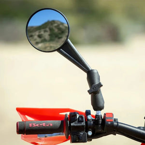 RAM Mounts M10 threaded ball adapter installed on a motorcycle handlebar mirror mount with a socket arm