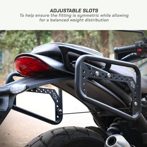 ViaTerra matte black steel saddlebag rack mounted on a Triumph Scrambler 400 X with adjustable slots