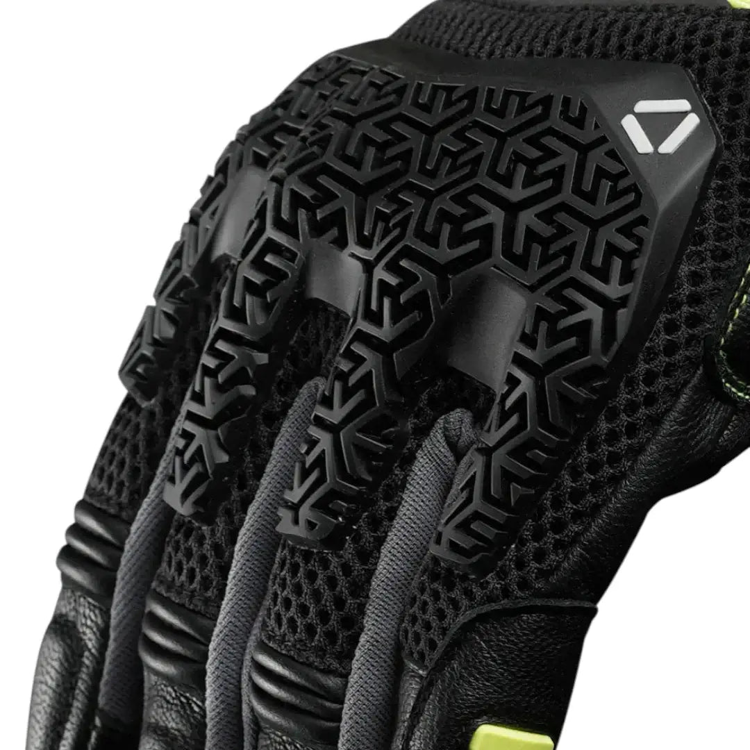 Korda Close-up of a black protective glove with textured palm and brand logo on a white background