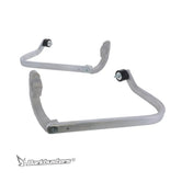 Metal bumper guard with mounting brackets on a white background, featuring the Barkbusters logo.