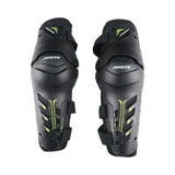 AXOR Impact-X black knee guards with neon yellow accents, dual-axis design, and hard shell protection.
