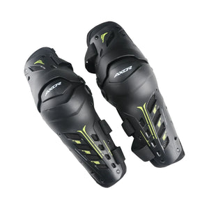 AXOR Impact-X black knee guards with neon yellow accents, featuring hard shell sliders and dual-axis design.