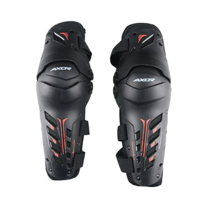 AXOR Impact-X black knee guards with dual-axis bionic design, hard shell sliders, and red accent details.