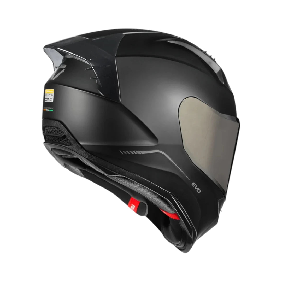 Motodrift Korda Evo Solid full-face motorcycle helmet in matte black with rear spoiler and safety certification labels