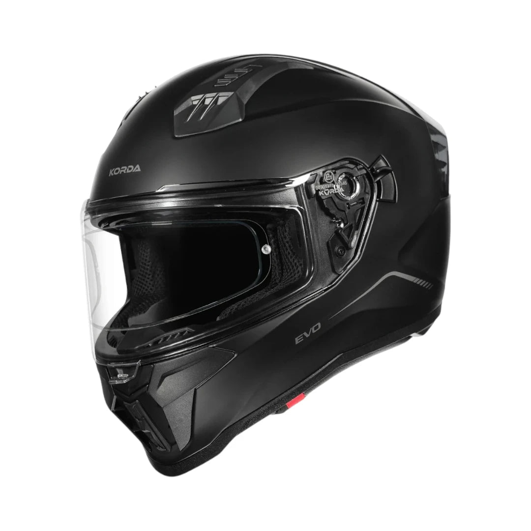Motodrift Korda Evo Solid full face motorcycle helmet in matte black with a clear visor and aerodynamic design.