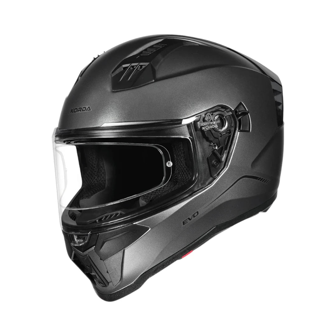Motodrift Korda Evo Solid full face motorcycle helmet in matte grey with a clear visor and aerodynamic shell design