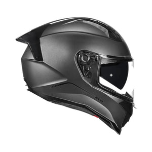 Motodrift Korda Evo Solid full face motorcycle helmet in matt grey with a clear visor and integrated sun shield