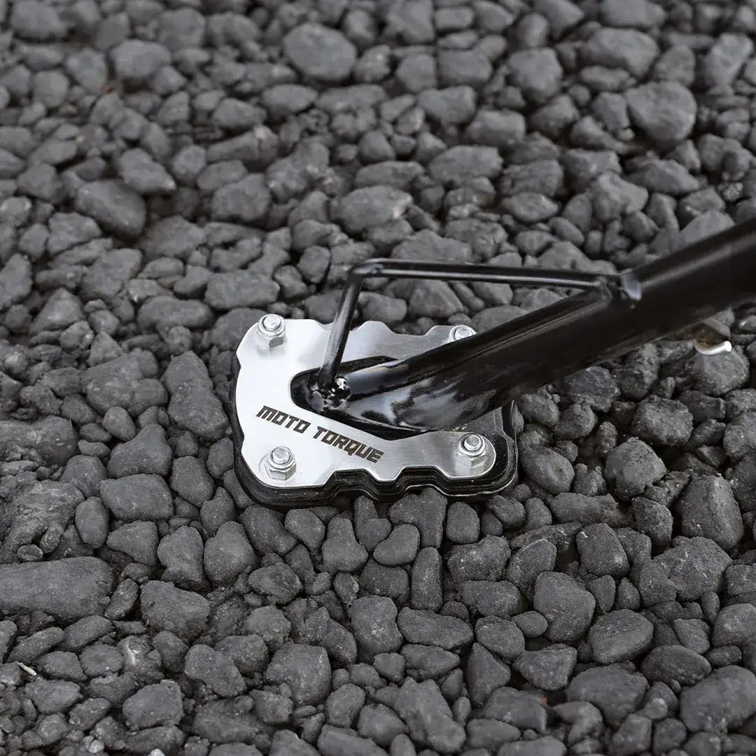 Moto Torque stand extender product on a gravel surface