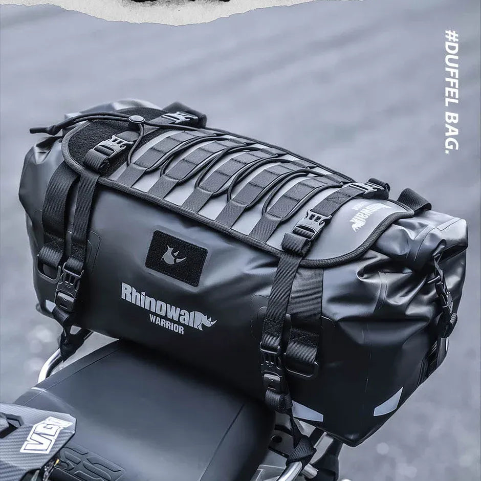 Motodrift Rhinowalk Warrior Series X black waterproof motorcycle roll-top duffel bag mounted on a bike seat.