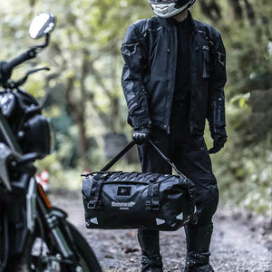 Motodrift Rhinowalk Warrior Series X waterproof motorcycle duffel bag in black 500D polyester with roll-top closure.