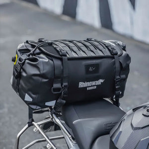 Motodrift Rhinowalk Warrior Series X black waterproof motorcycle roll-top duffel bag mounted on a bike seat
