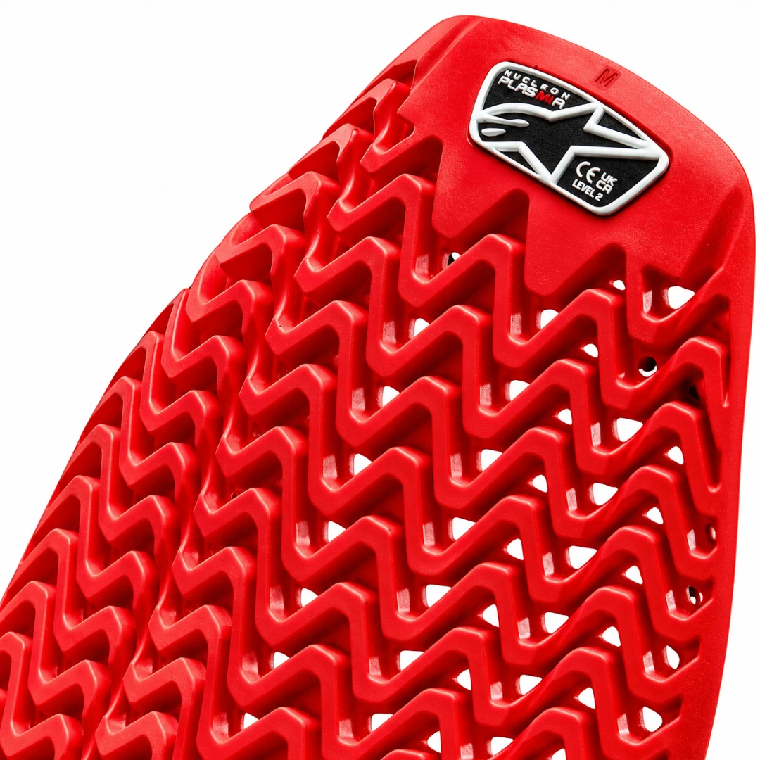 Alpinestars RK-1 Plasma knee brace red Nucleon impact-absorbing material with textured zigzag pattern