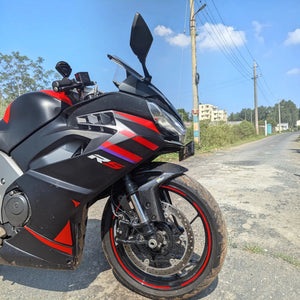 Three-quarter front view of Aprilia RS 457 with black and red bodywork