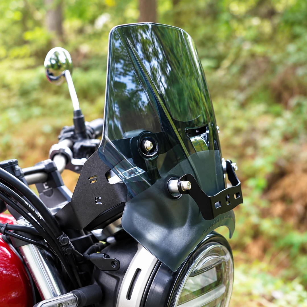 Carbon Racing BOLT smoked windscreen installed on a Honda CB 350 RS motorcycle with steel mounting brackets.