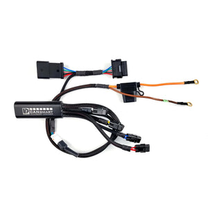 DENALI CANsmart GEN II controller with black wiring harness and connectors for BMW motorcycle accessories.