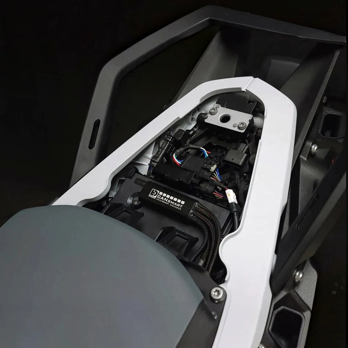 DENALI CANsmart GEN II controller installed under the seat of a BMW R 1300 GS motorcycle.