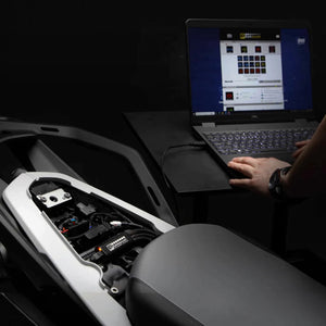 DENALI CANsmart GEN II controller being configured on a laptop for a BMW motorcycle electrical system.