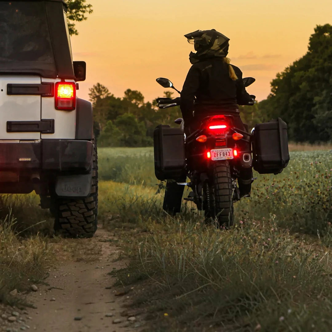 Denali T3 license plate mount installed on a motorcycle rear, enhancing visibility with side signal pods
