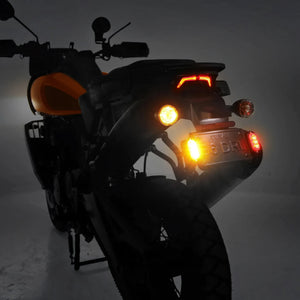 DENALI T3 modular LED rear signal pods with red brake lights and amber turn signals on a motorcycle