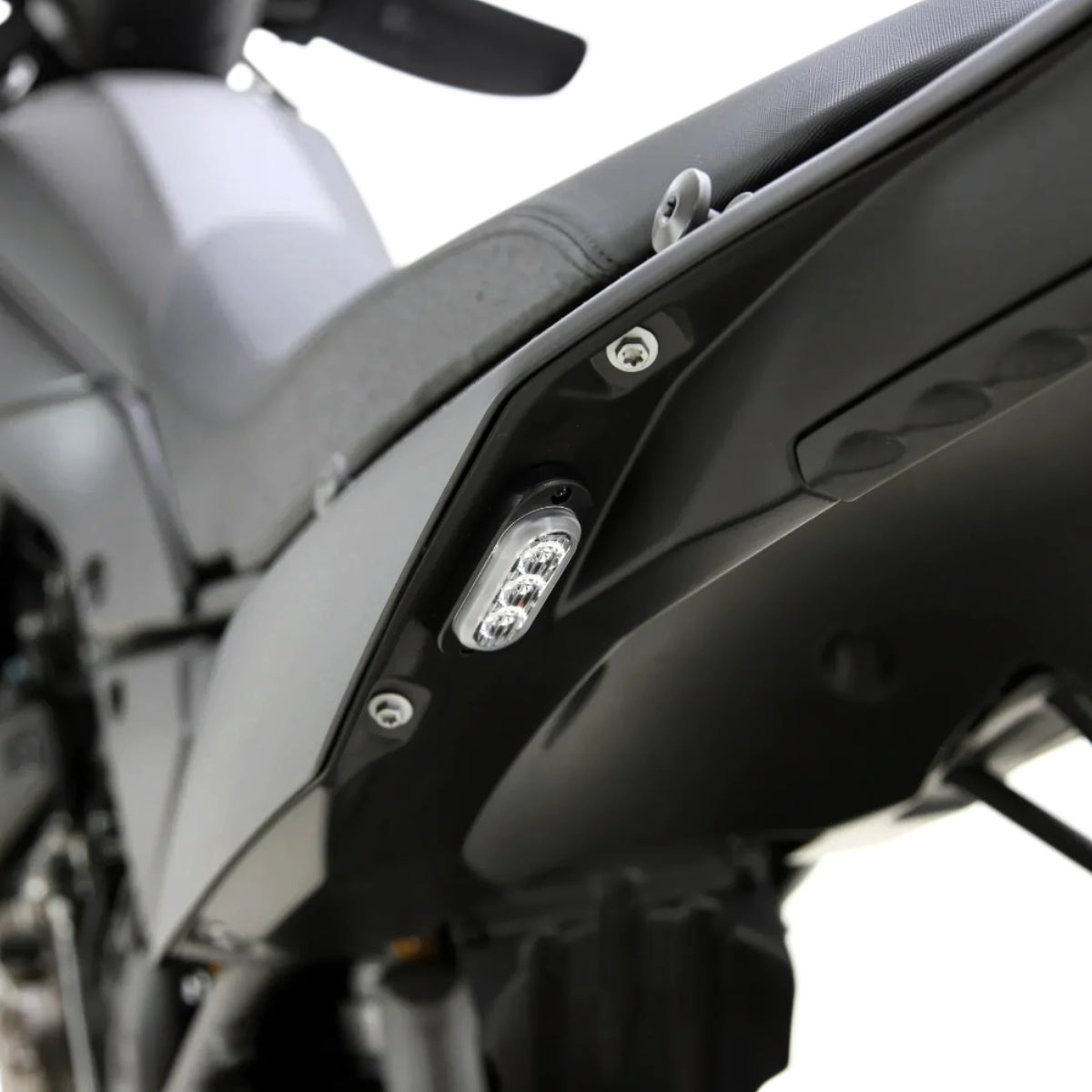 DENALI T3 modular LED rear turn signal pod mounted flush on a motorcycle fender