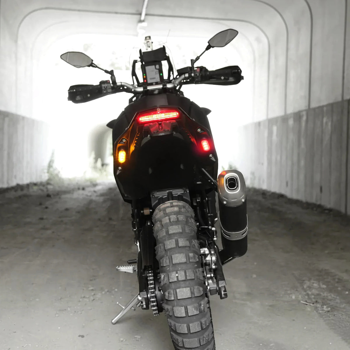DENALI T3 modular LED rear turn signal pods with red brake and amber indicator lights on a motorcycle.