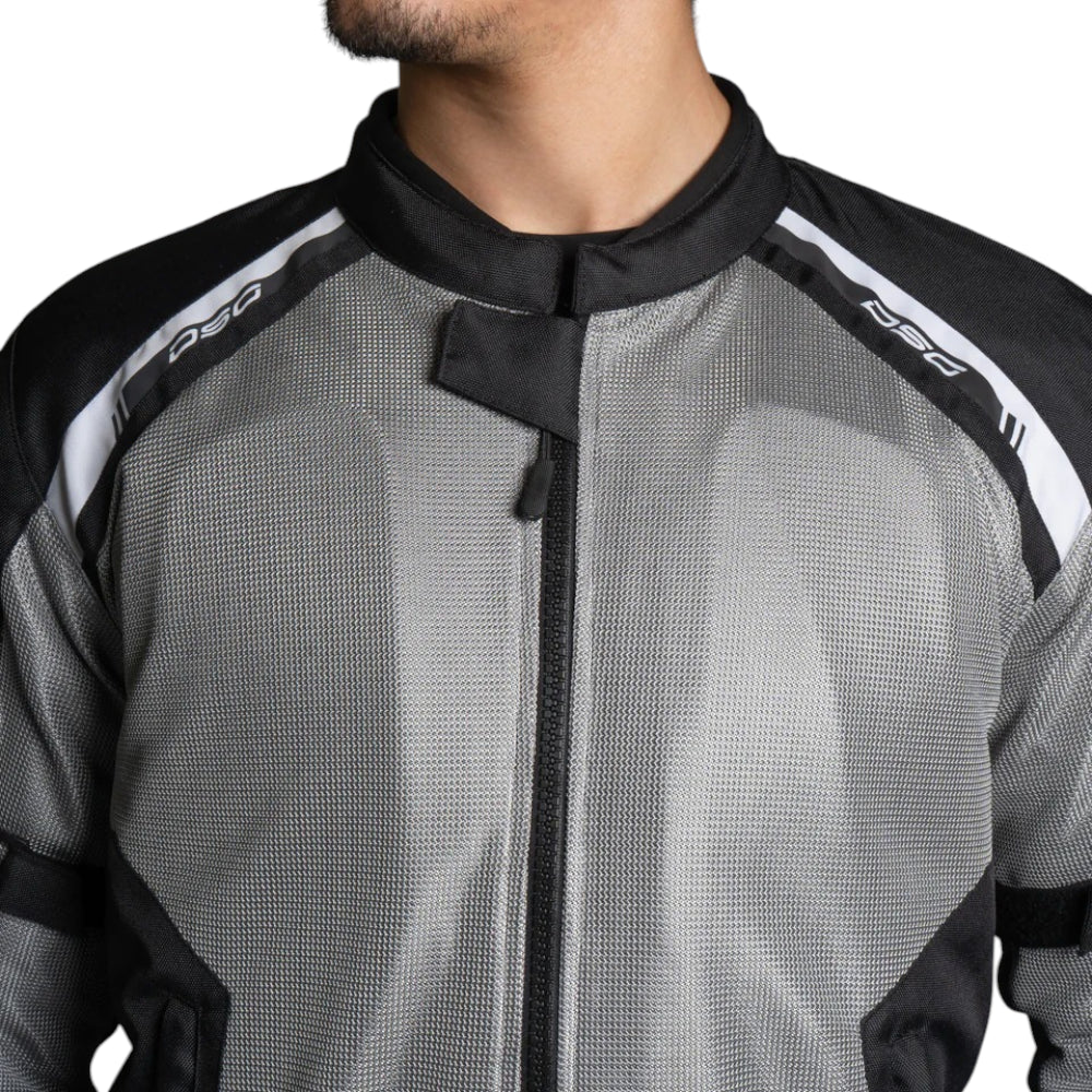 Gray motorcycle jacket with black and white accents on a person, featuring the brand 'DSG'.