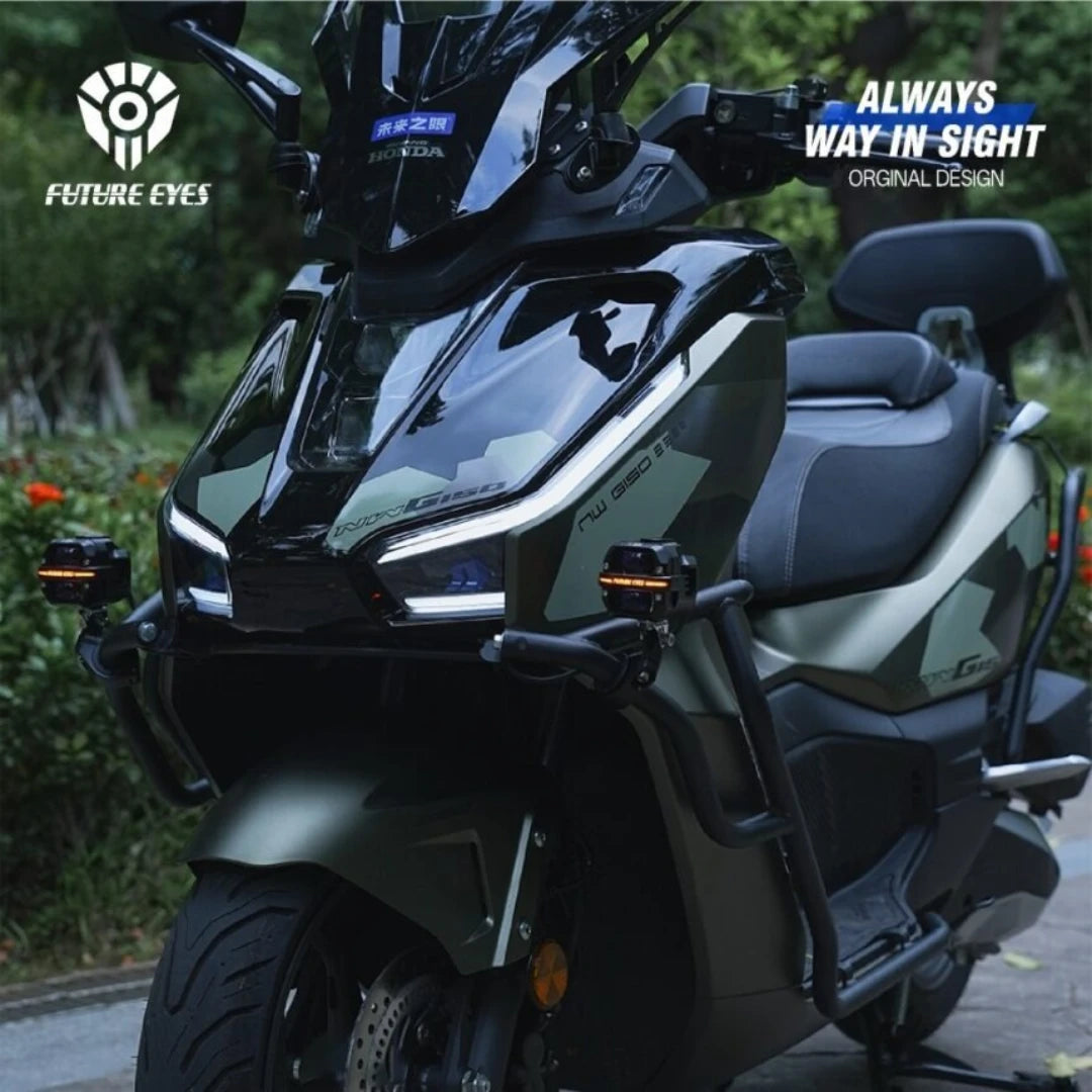 Future Eyes X60 LED auxiliary lights mounted on a matte green adventure scooter for enhanced night visibility