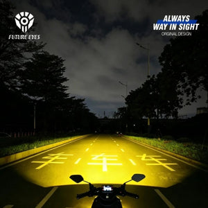 Future Eyes X60 LED motorcycle auxiliary lights casting a bright yellow beam on a dark road at night
