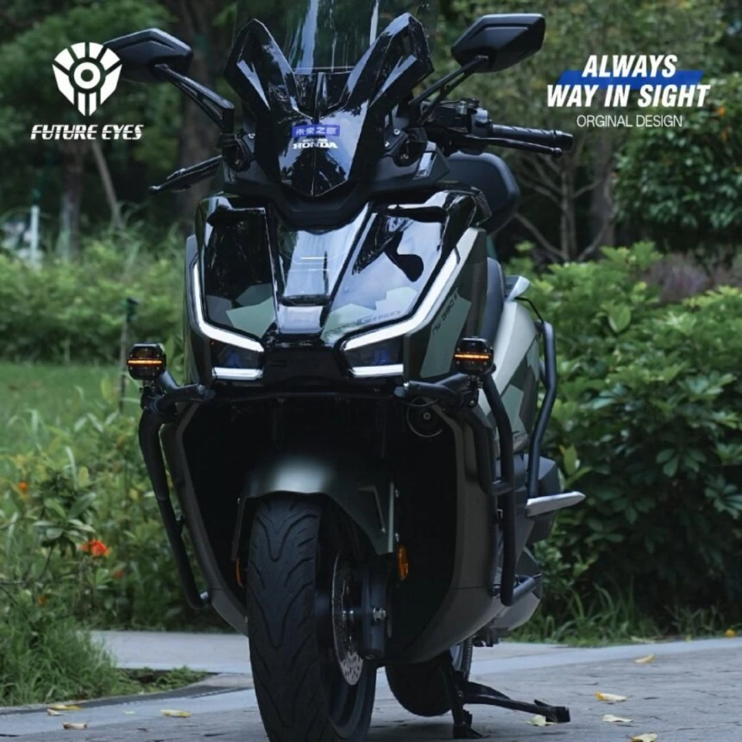 Future Eyes X60 LED auxiliary lights mounted on a modern adventure scooter for enhanced night visibility
