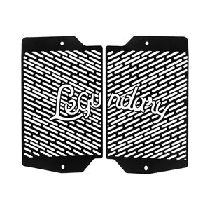 Legundary Vector radiator grill for Triumph Tiger 900 in black aluminium with a protective slotted design.