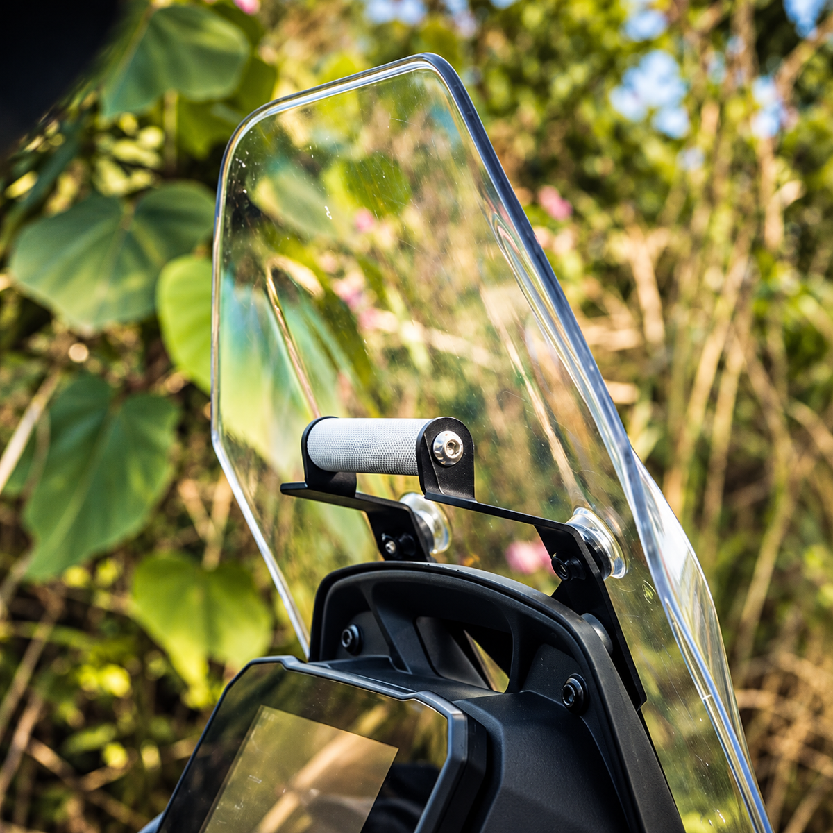 Ploigos GPS mount with visor extender installed on a TVS Apache RTX 300 motorcycle windscreen